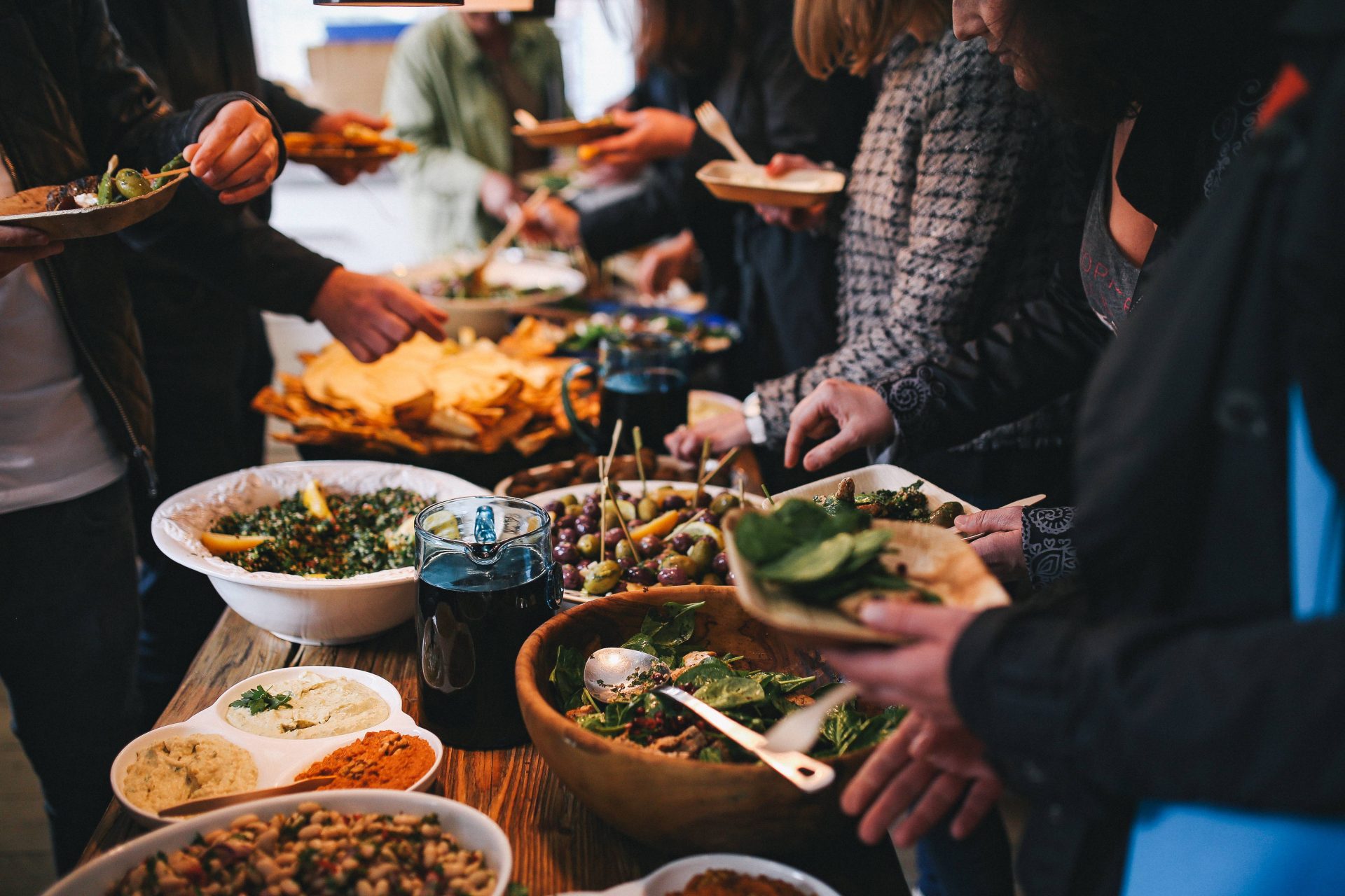 People feasting on healthy salad buffet